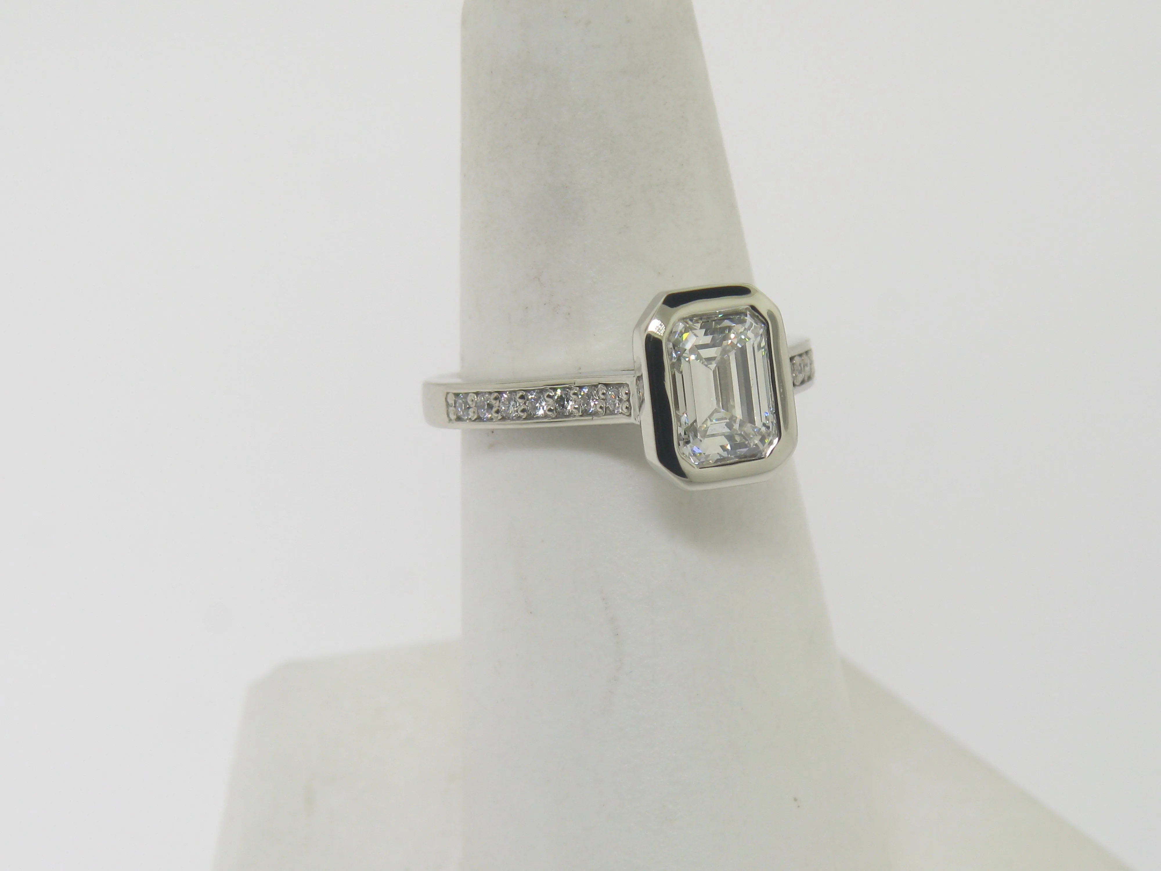 Emerald Cut Diamond In Wide Edge Bezel