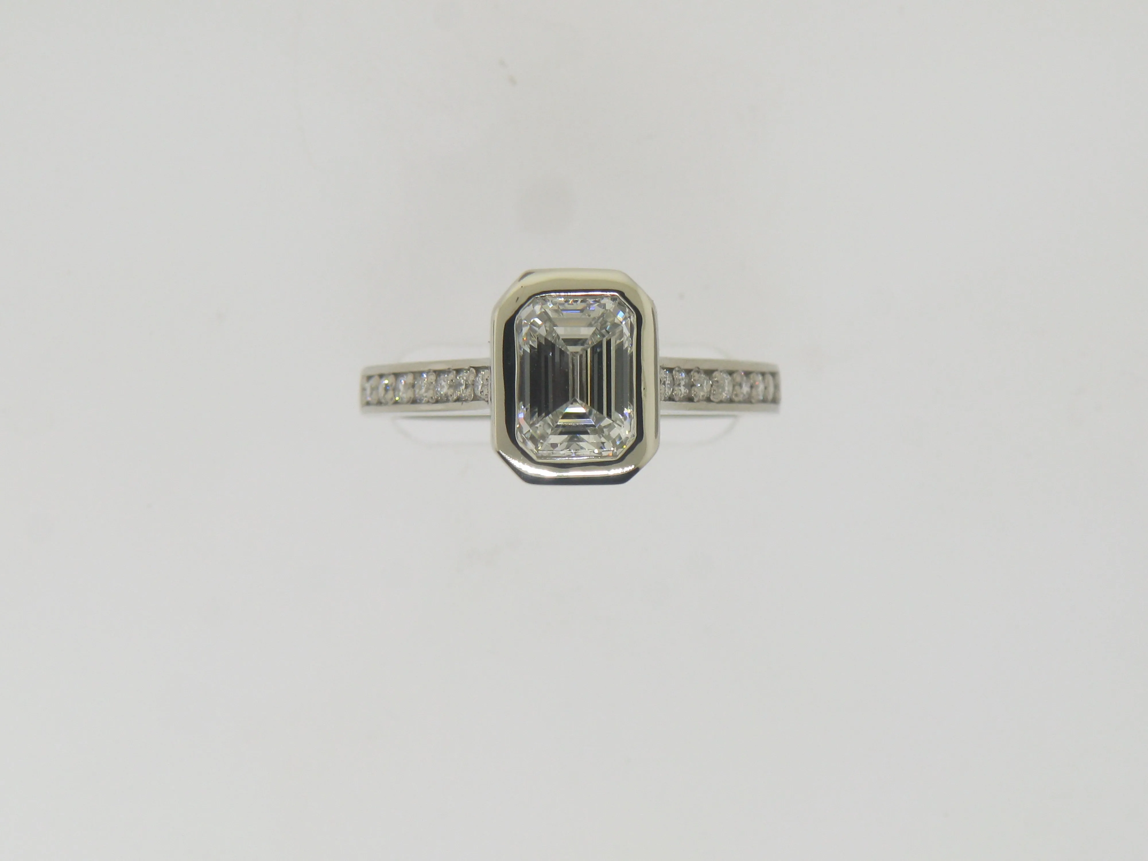 Emerald Cut Diamond In Wide Edge Bezel