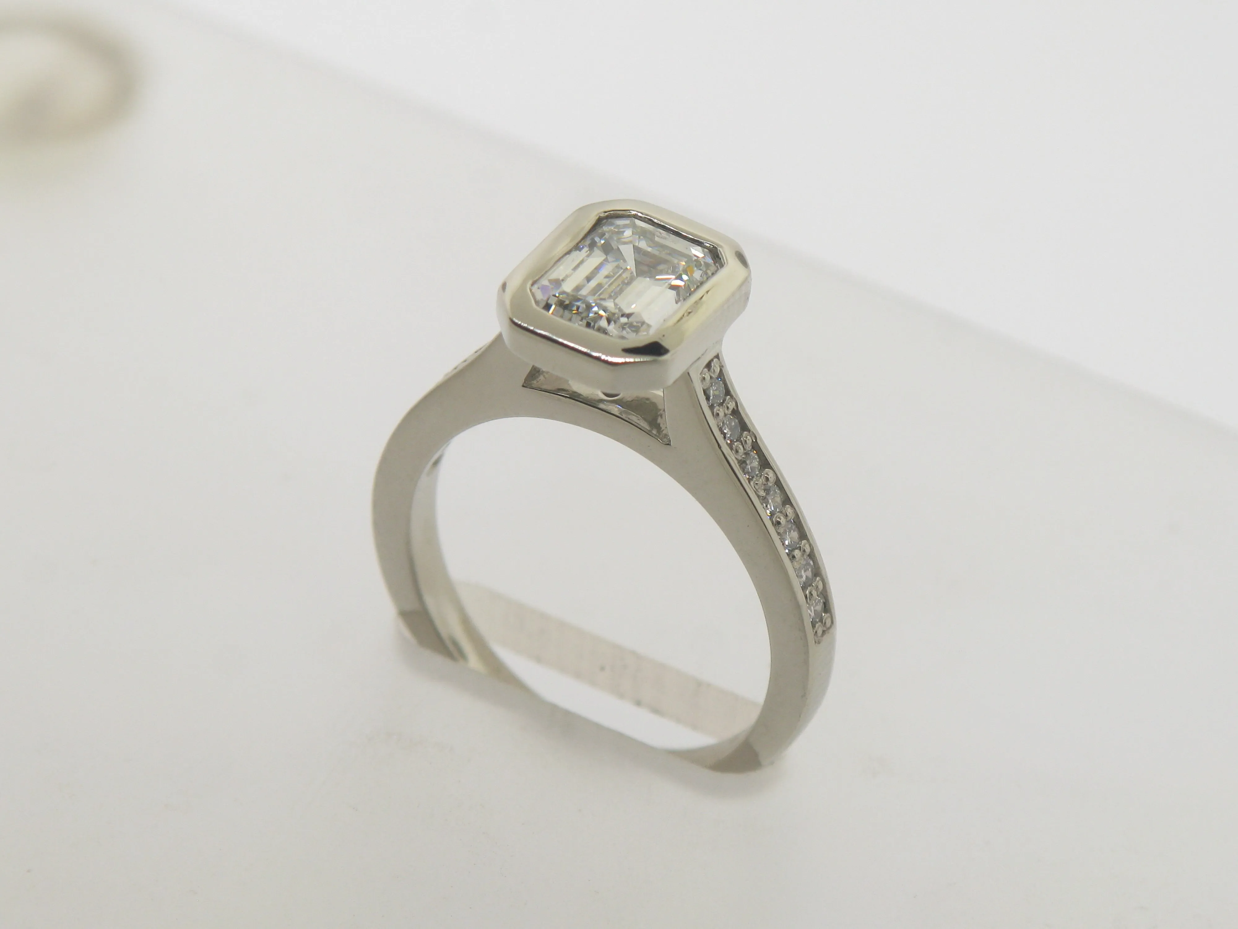 Emerald Cut Diamond In Wide Edge Bezel