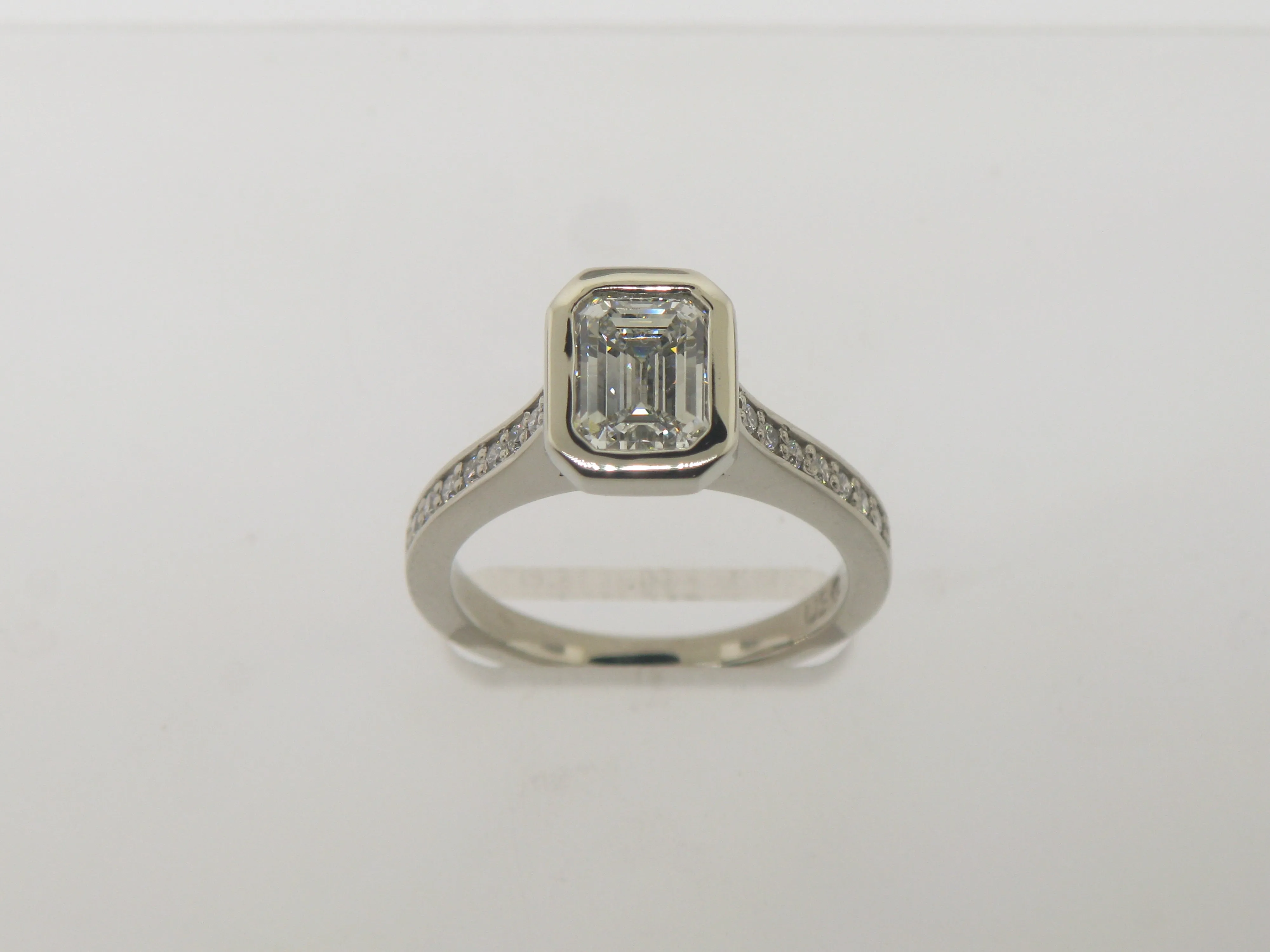 Emerald Cut Diamond In Wide Edge Bezel