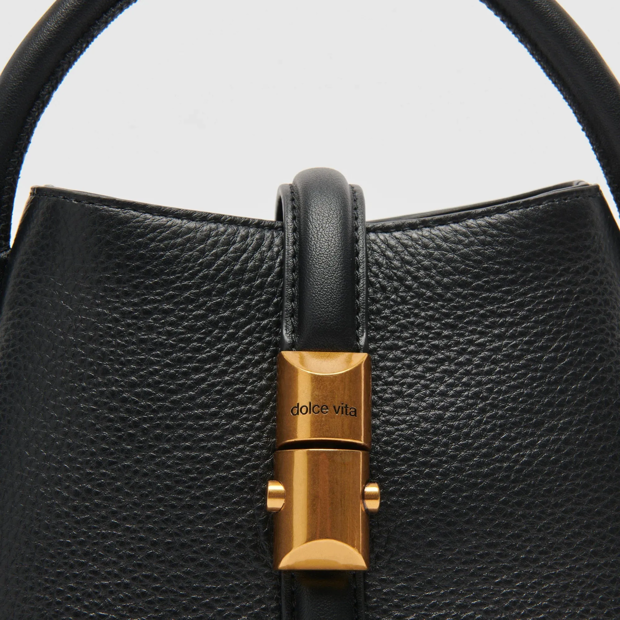 The Neve Mini Bucket Bag by Dolce Vita - Black Leather